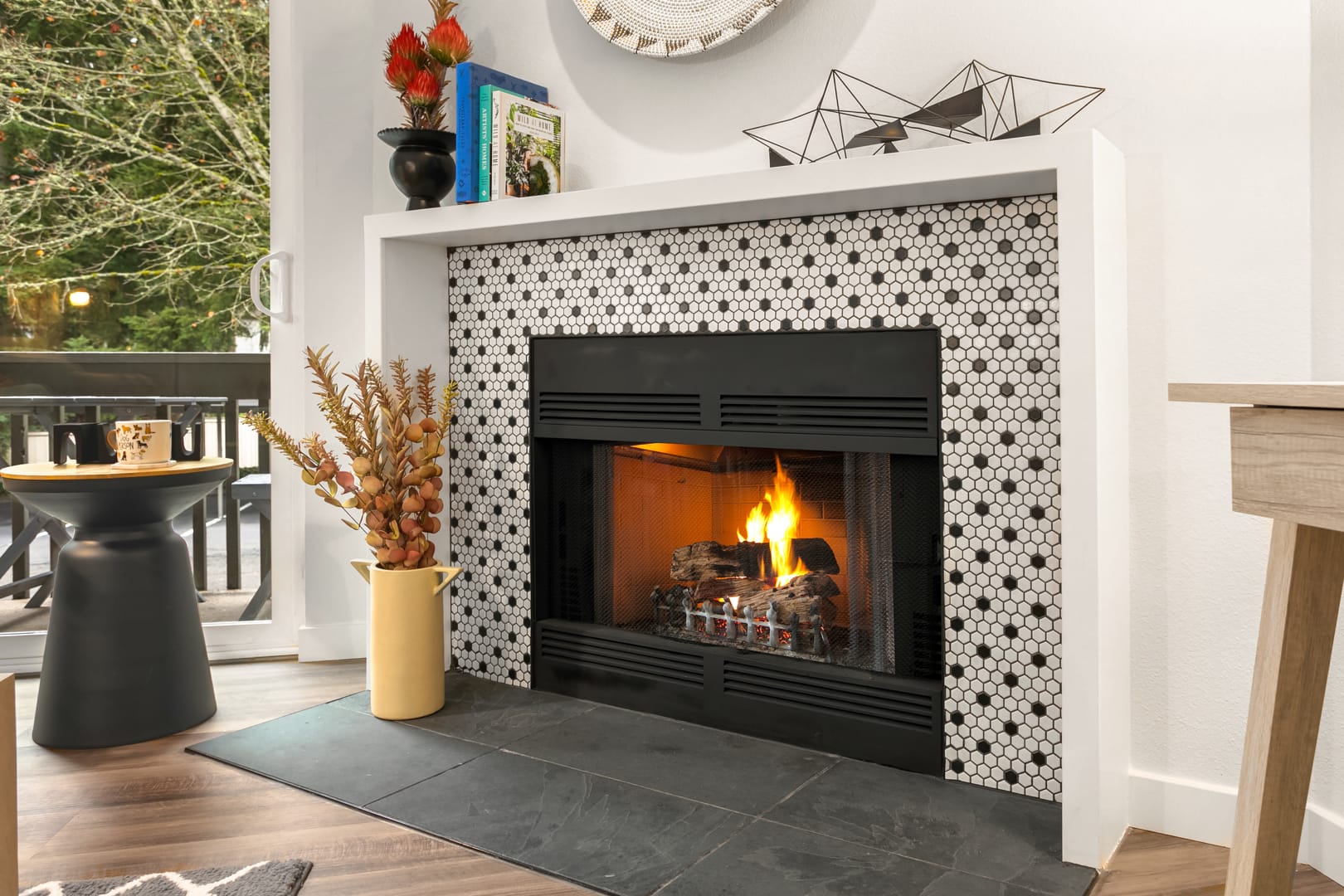 Close up view of the black and white geometric tiled fireplace